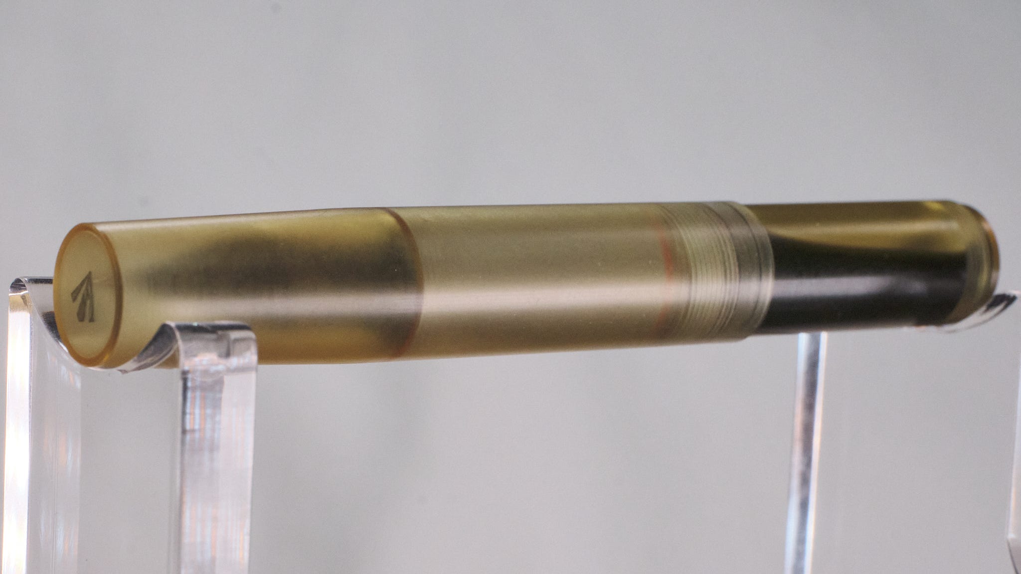 Photo showing a small, semi-transparent yellow fountain pen made from Ultem.