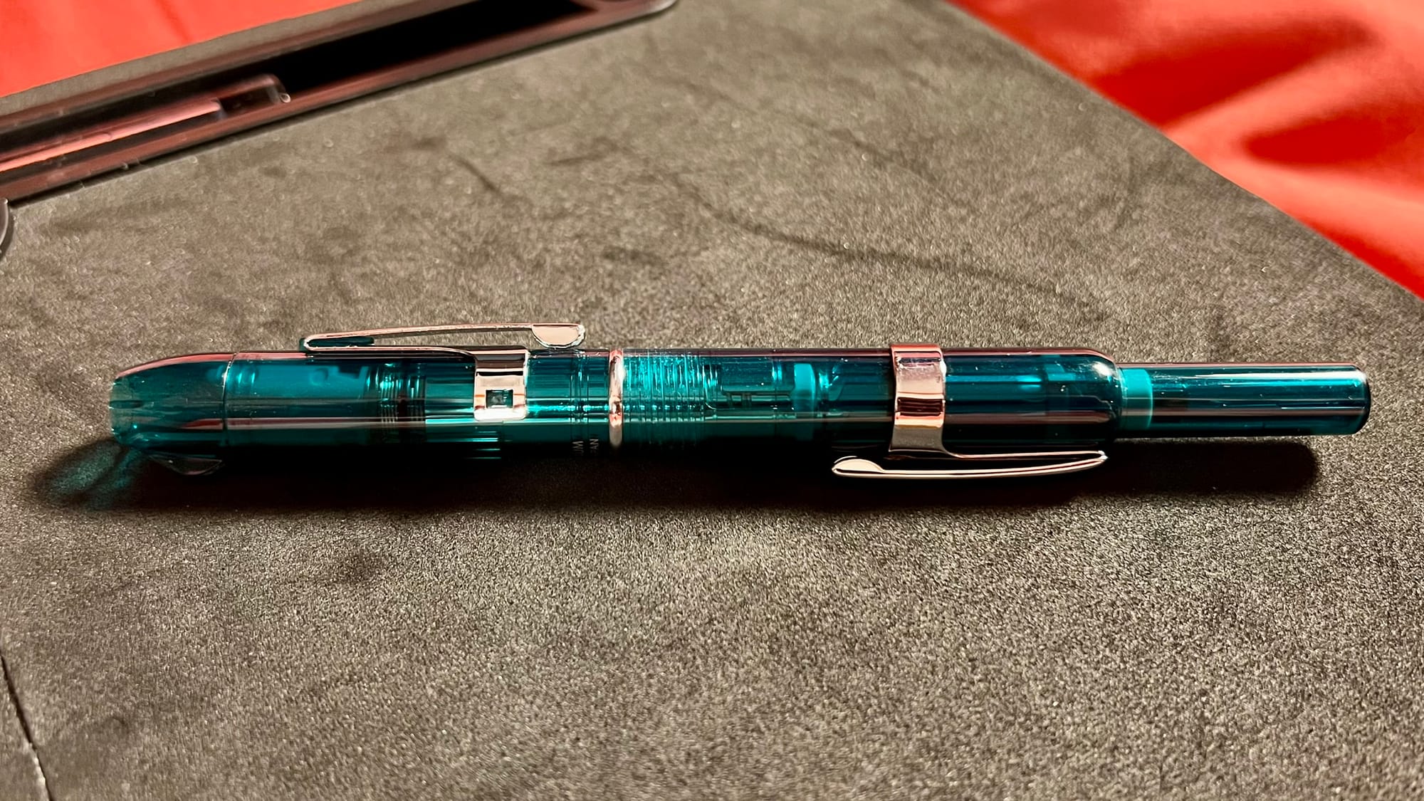 Photo of a green Platinum Curidas with the A3 clip attached to the back.