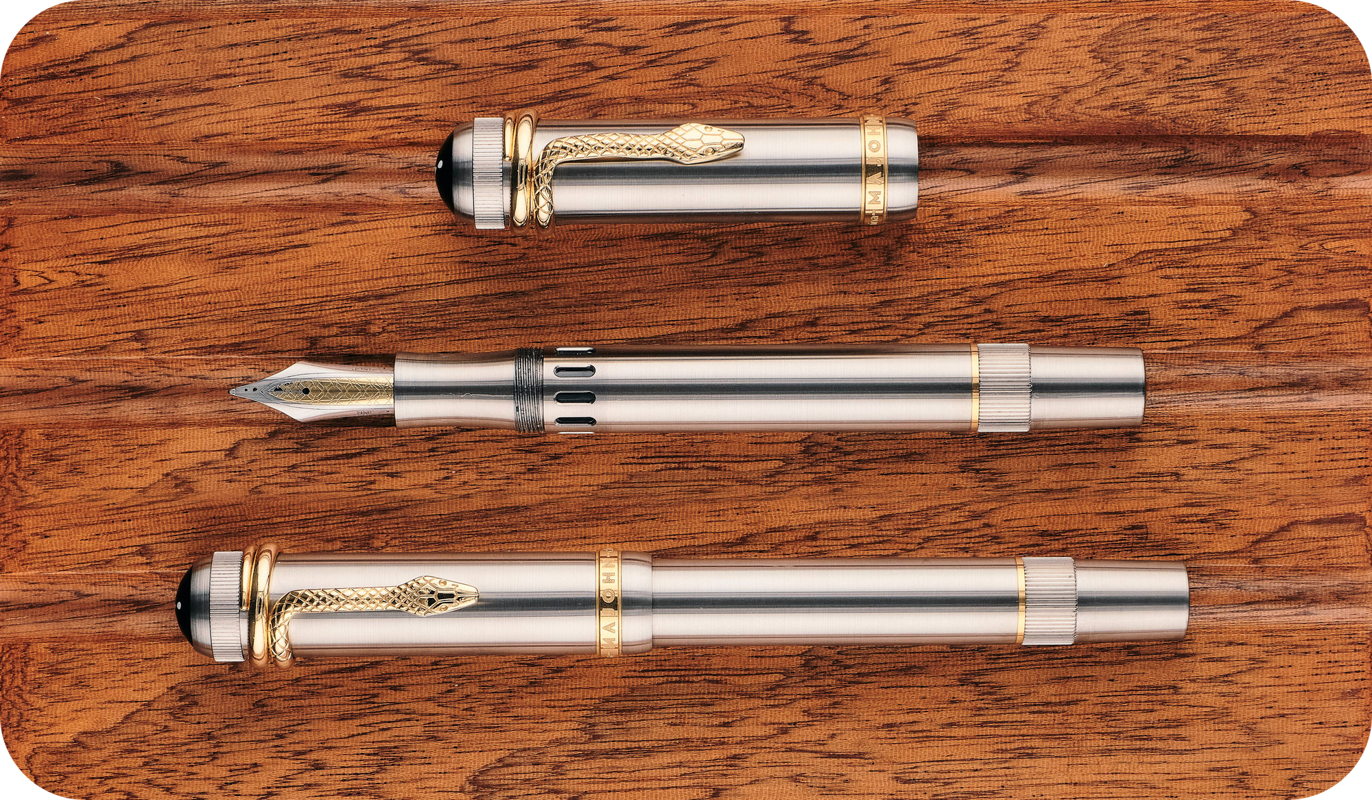 Overhead photo of the titanium P137 with its cap on & off on a wooden board