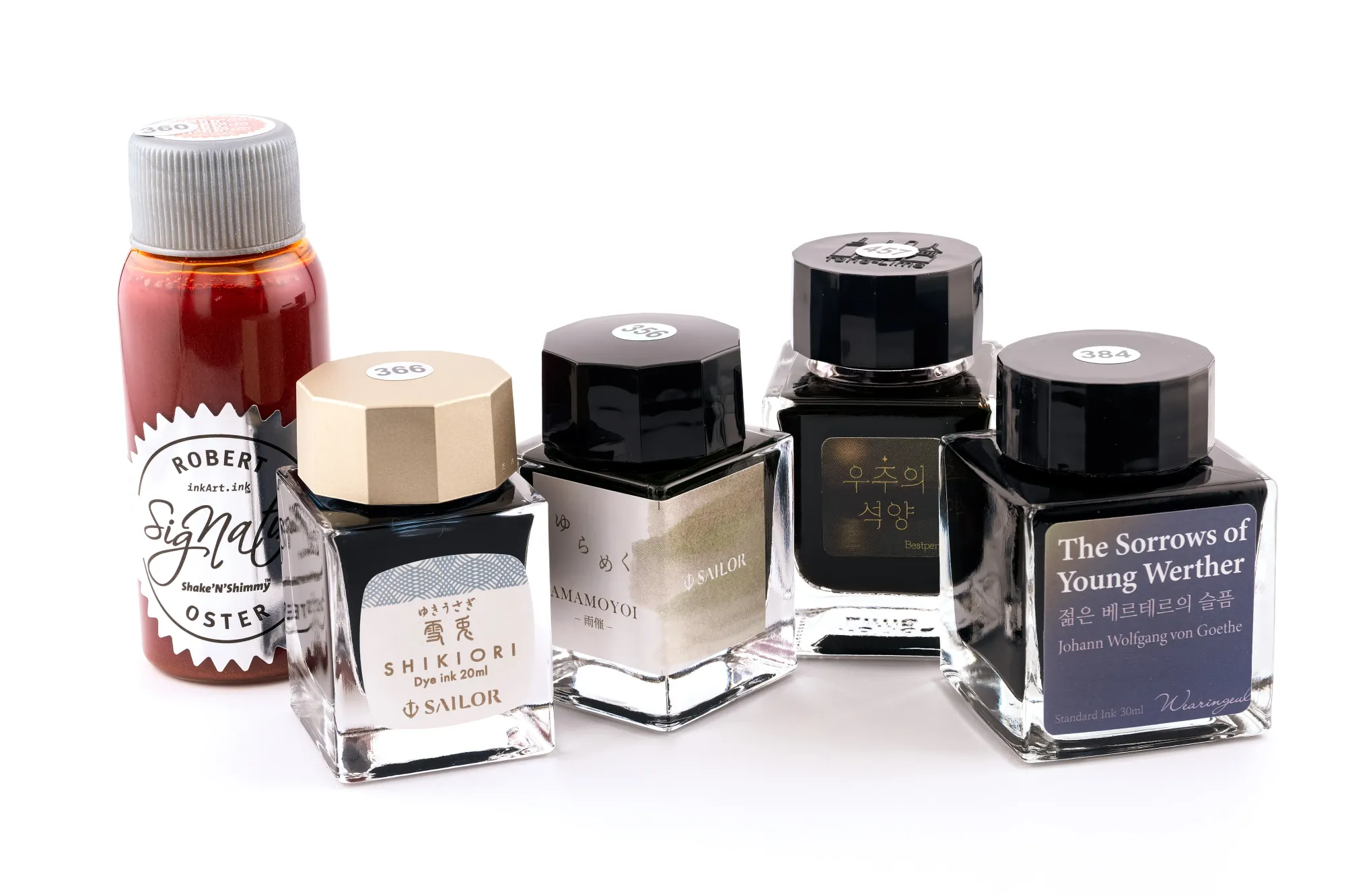 Photo of 5 ink bottles against a white background. From left to right: Robert Oster × The Pen Addict - Fire on Fire on Fire, Sailor - Yuki Usagi, Sailor - Amomoyoi, Tono & Lims × Bestpen - Space Sunset, Wearingeul - The Sorrows of Young Werther